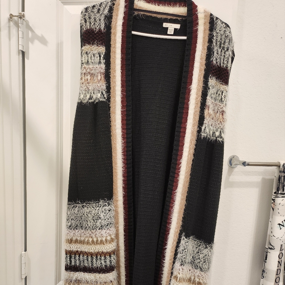 Sweater vest, black with tan, white, and maroon. Cato brand size 18/20W.